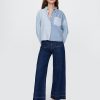 Knöchellange Jeans mit weitem Bein und hohem Schritt Knöchellange Jeans mit weitem Bein und hohem Schritt