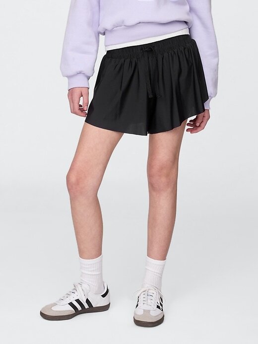 Laufshorts mit Schmetterlingssaum für Kinder Laufshorts mit Schmetterlingssaum für Kinder