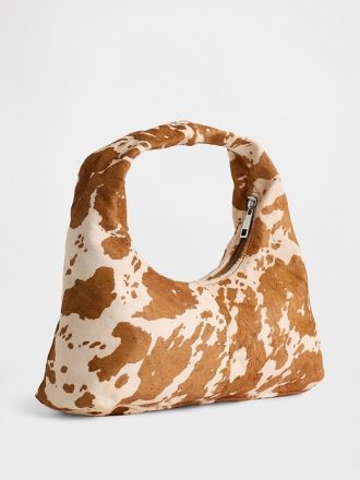 Mini-Slouchy-Tasche aus Kalbshaar mit Kuh-Print
