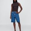 Modernes, gerüschtes, kurzes Tanktop mit Trichterhals Modernes, gerüschtes, kurzes Tanktop mit Trichterhals