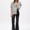 Schlaghose im 70er-Jahre-Stil aus veganem Leder mit hohem Bund Schlaghose im 70er-Jahre-Stil aus veganem Leder mit hohem Bund